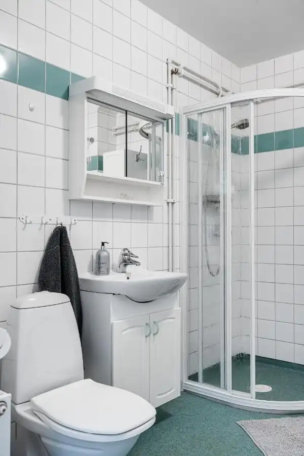 Tiled bathroom with glass shower in Uppsala short term rental