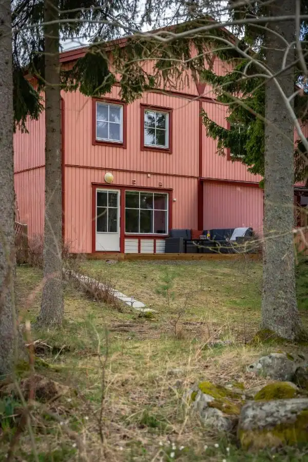 Backyard view of pink house for rent in Uppsala