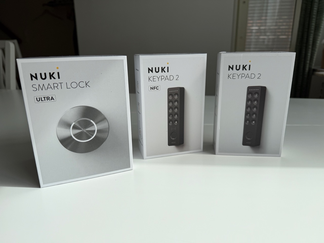 Nuki Smart Lock Ultra, Keypad 2 NFC, and Keypad 2 boxes side by side