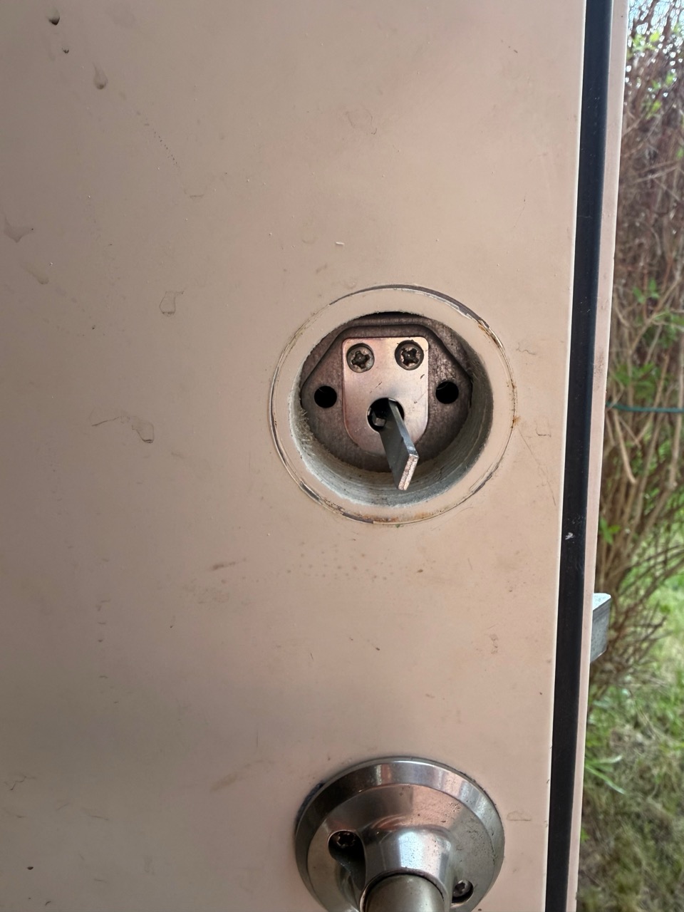Empty cylinder hole with bolt visible