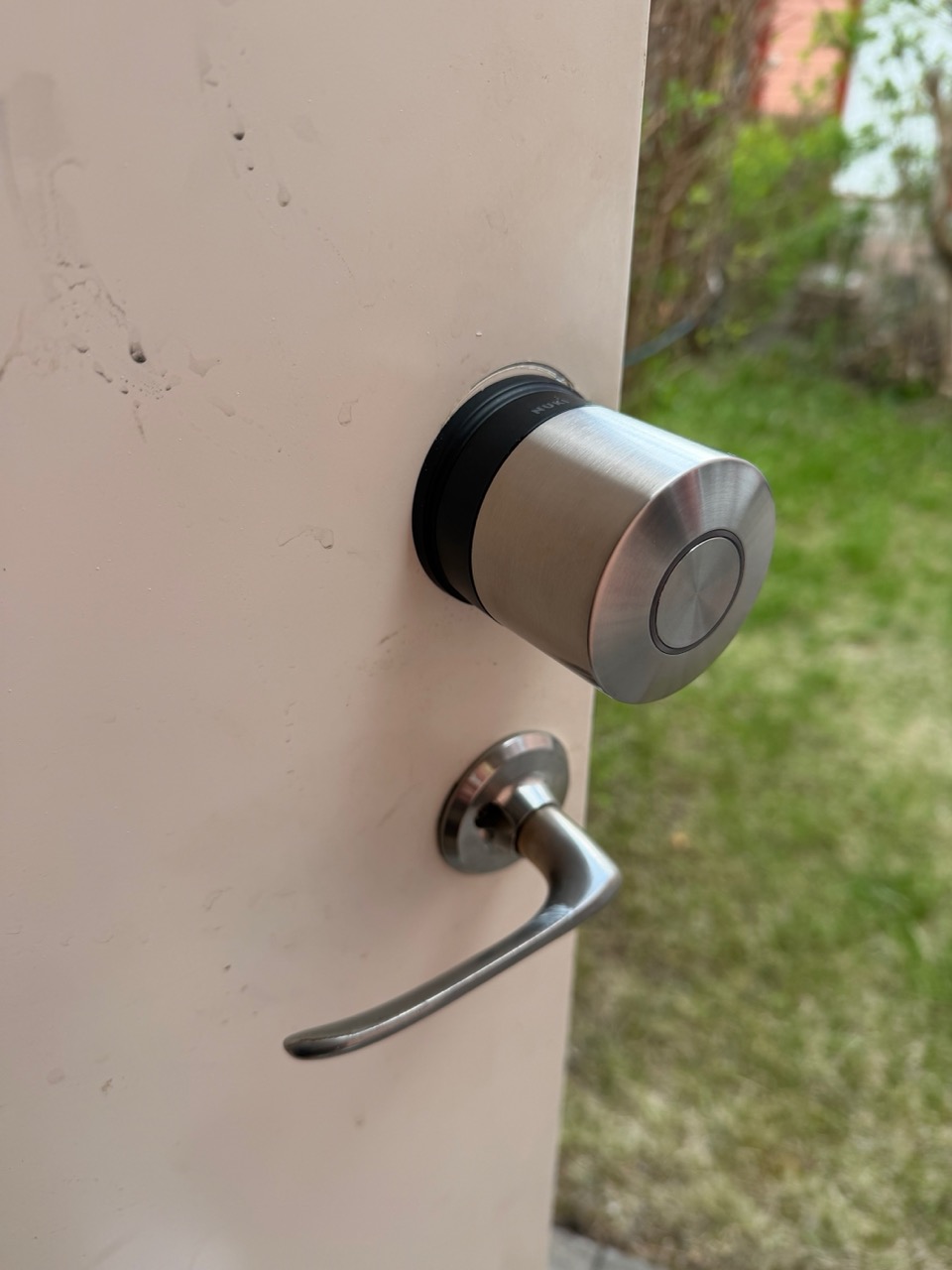 Nuki Smart Lock Ultra Nordics installed on the storage room door, viewed from inside with door open
