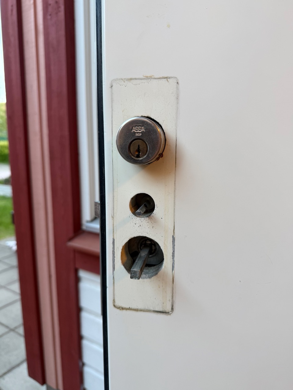 Front door interior plate removed showing three holes