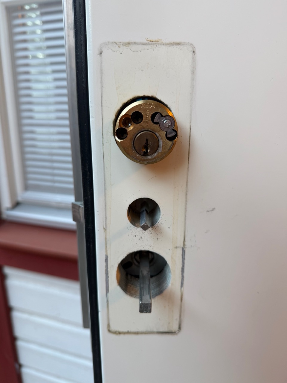 Front door interior cylinder mid-removal
