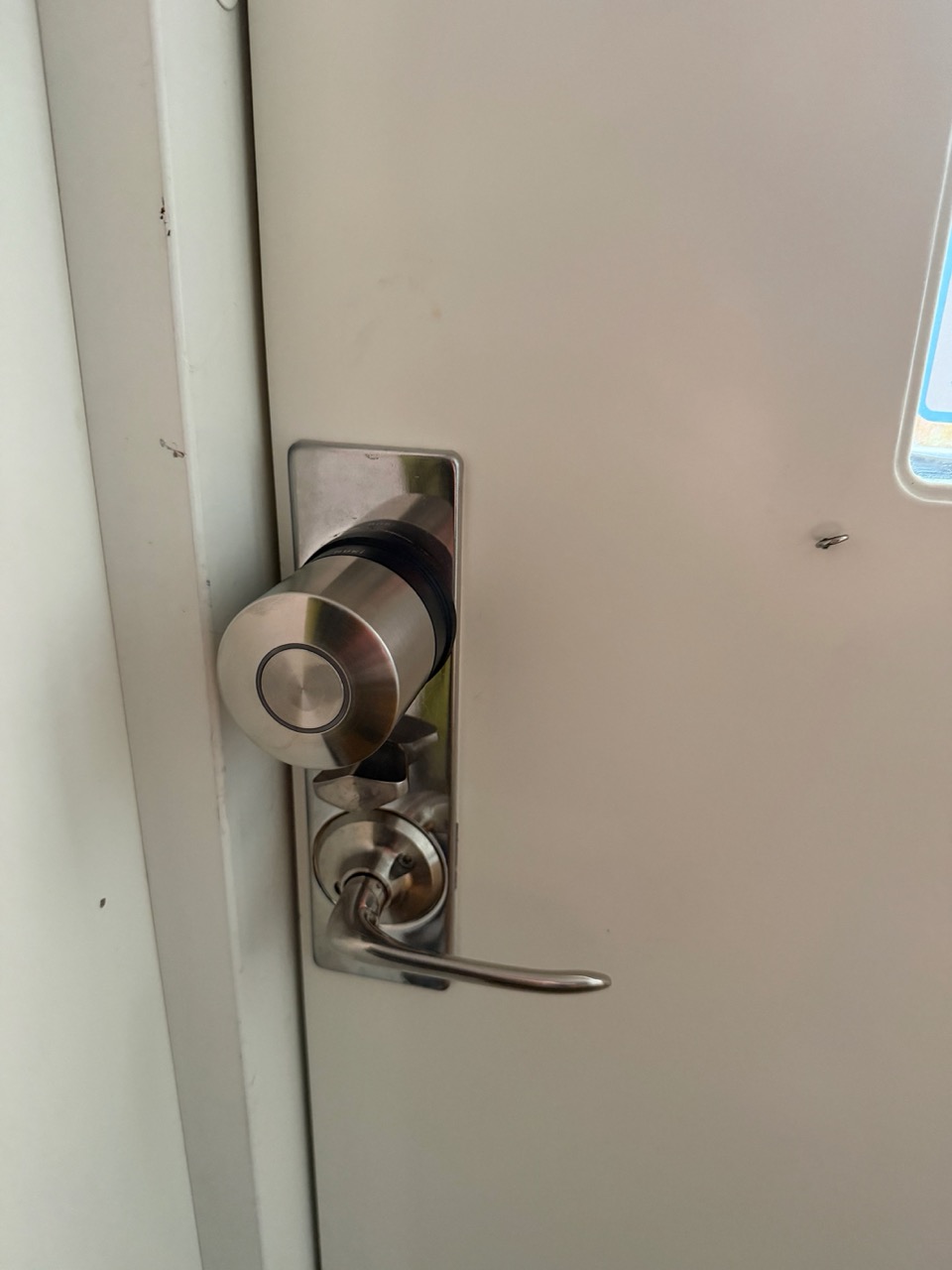 Nuki Smart Lock Ultra Nordics mounted on the front door — final shot