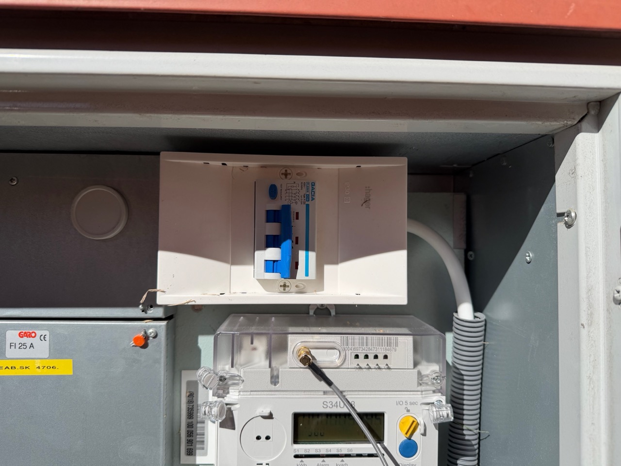 Close-up of newly installed 20A three-phase Hager breakers