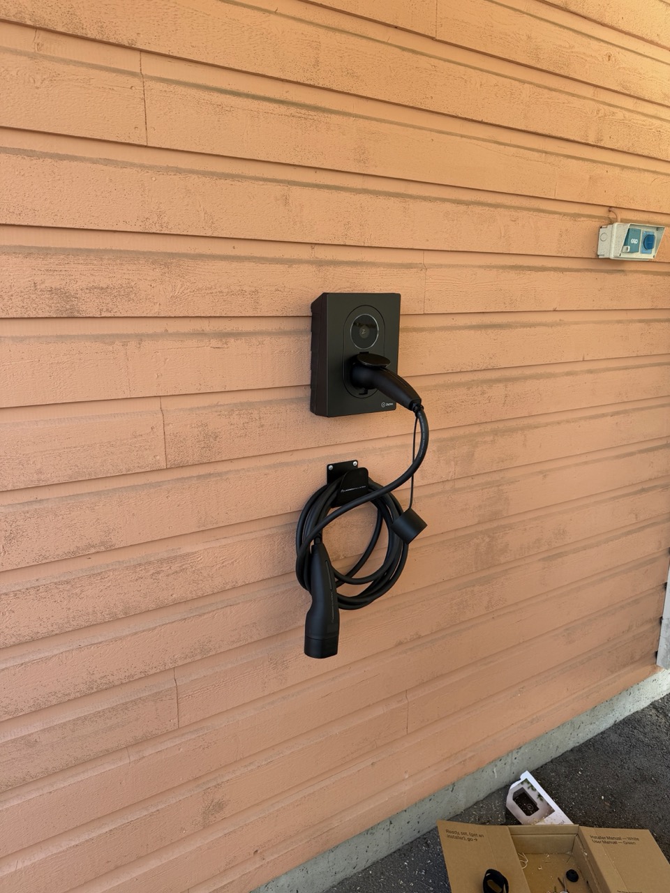 Zaptec Go 2 fully installed with cable cleanly coiled below