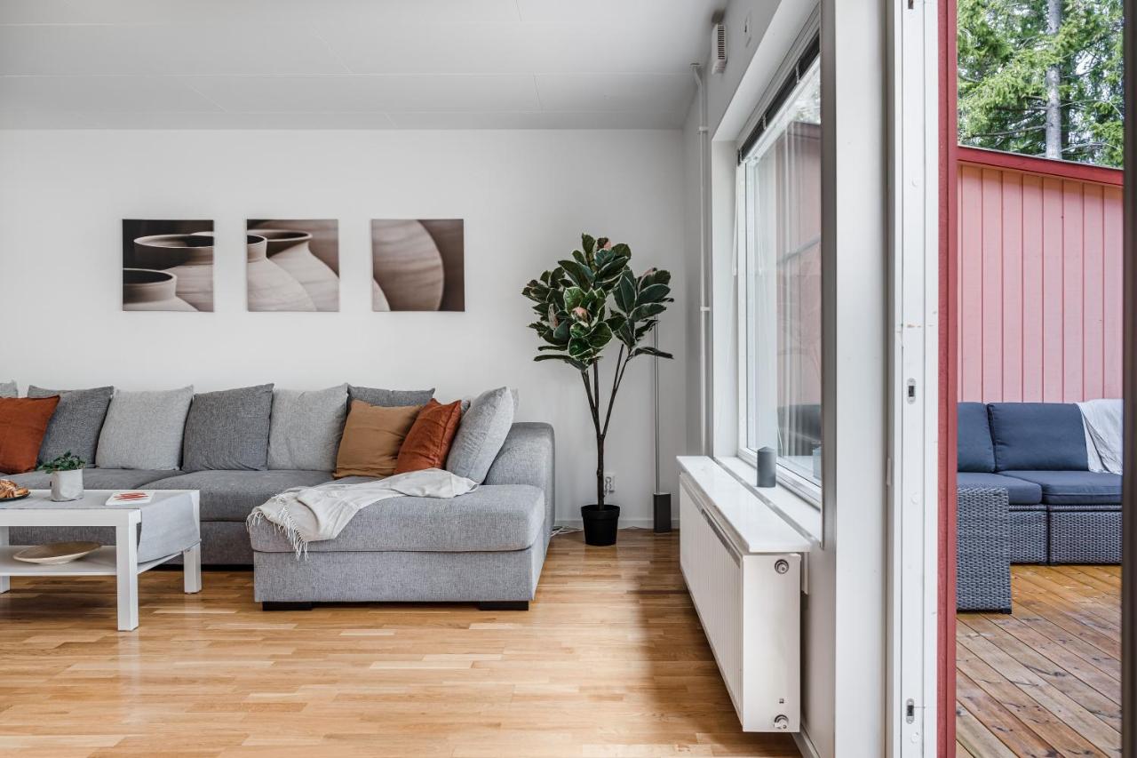 Bright living room with deck access in Uppsala short term rental