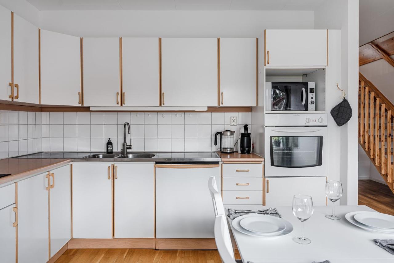 Fully equipped white kitchen in Uppsala house for rent